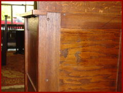 Remnants of Gustav Stickley paper label on the back of dresser.